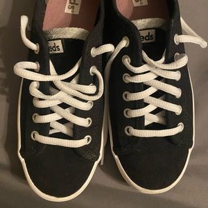 Never worn. Size 7. Black and white Keds.